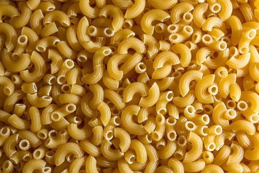 Uncooked Chifferi Rigati Pasta. A Culinary Canvas of Chifferi Rigati, Creating a Lively and Textured Background for Gourmet Cooking. Dry Pasta. Raw Macaroni - Top View, Flat Lay photo