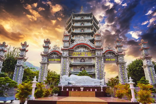 Reclining Buddha statue, gate and Thap Xa Loi Temple at Linh Ung Pagoda in Da Nang in Vietnam in Asia photo