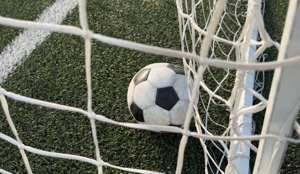 Traditional soccer ball on soccer field photo