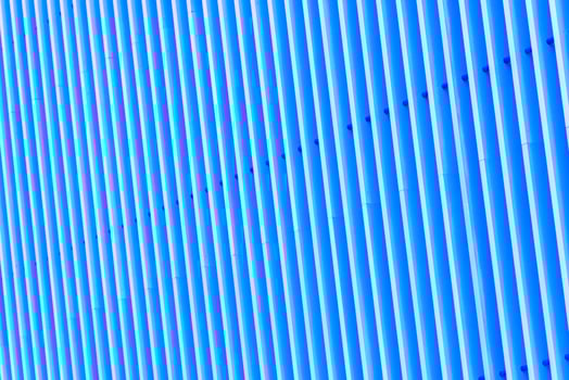 Detail of blue striped metal facade for background photo
