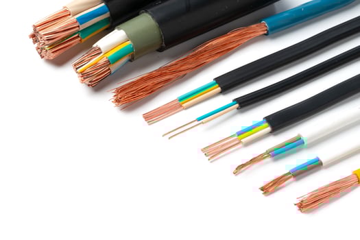 Various Electrical Wires With Exposed Copper Strands on White Background photo