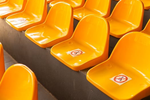 Plenty of yellow plastic seats at stadium. photo
