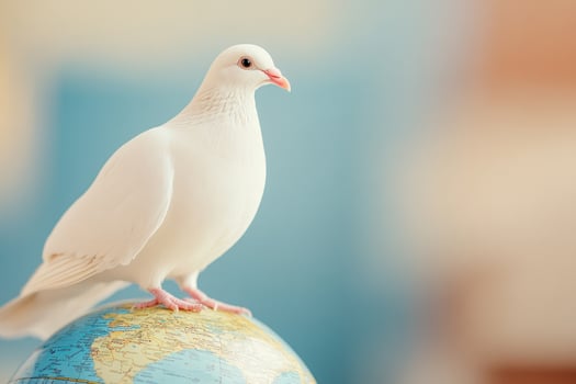 White dove perched on a globe representing unity and peace under warm, hopeful lighting photo