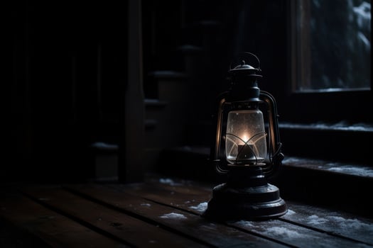 Vintage oil lamp illuminating a dark cabin photo