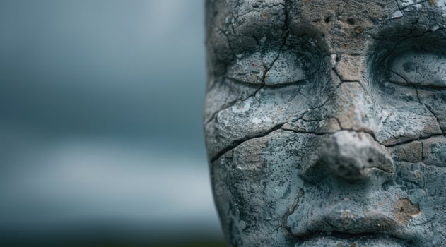 close up of weathered stone face photo