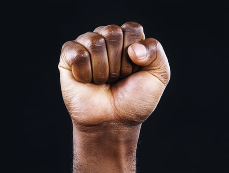 Clenched fist of a persons hand photo