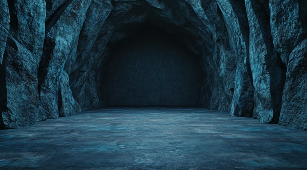 Mysterious dark cave with glowing blue water photo
