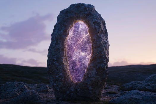 Glowing amethyst crystal in a rugged landscape photo