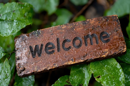 Rustic welcome sign in nature photo