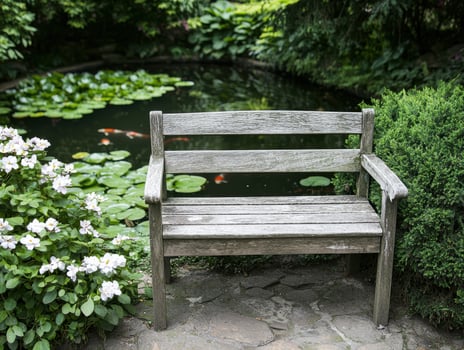 Peaceful garden bench overlooking a serene pond photo