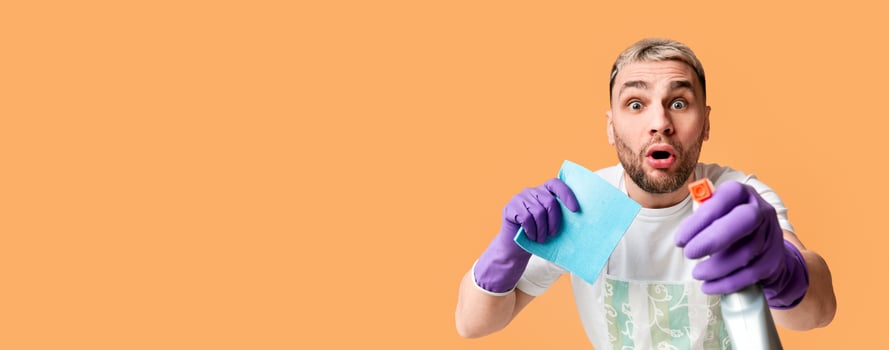 Man wipes the screen with spray and napkin, free space photo