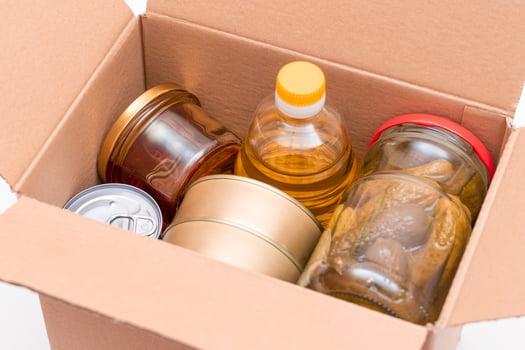 Food Reserves or Donation Box. Carton Box with Canned Food, Cereals and Grocery. Emergency Food Storage in Case of Crisis. Free Social Help, Blessings and Care. Strategic Food Supplies photo