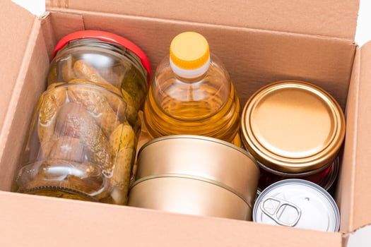 Food Reserves or Donation Box. Carton Box with Canned Food, Cereals and Grocery. Emergency Food Storage in Case of Crisis. Free Social Help, Blessings and Care. Strategic Food Supplies photo