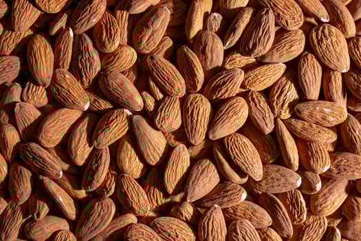 Scattered Almonds. Background from Almond Nuts. Natural High-Calorie Snacks photo