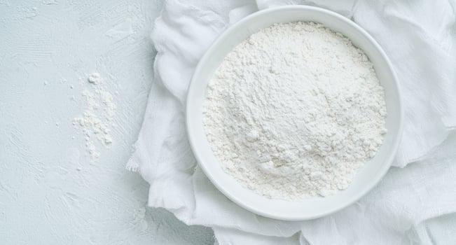 Freshly milled flour in a white bowl photo