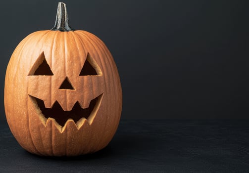 Carved Halloween pumpkin with scary face photo