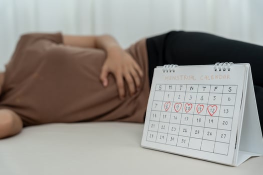 stomach ache. Asian women have abdominal pain, indigestion, gastritis, menstrual cramps, flatulence, diarrhea, distention, colon cancer, belly inflammation problem, suffer food poisoning, abdomen photo