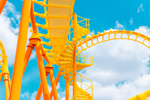 Rollercoaster railroad track high to the sky roll bend and twist for exciting fun at theme park photo