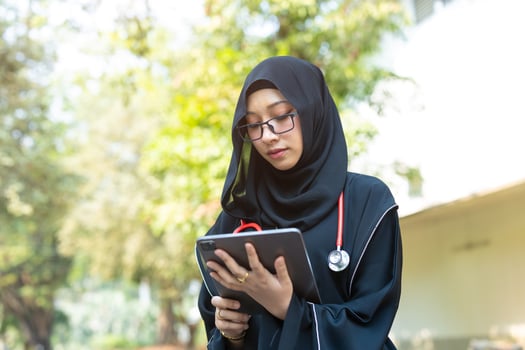Saudi teen with stethoscope for high education arab women lifestyle in doctor school university campus nature background. photo