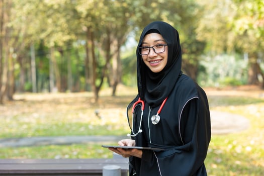 Saudi teen with stethoscope for high education arab women lifestyle in doctor school university campus nature background. photo