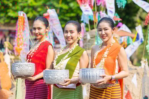 Songkran festival. Portrait Northern Thai people in Traditional clothes dressing handle handcrafted silver bowl in Songkran day summer Thailand cultural festival. photo