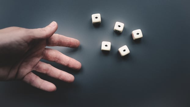 Throwing the dice on a dark grey background. photo