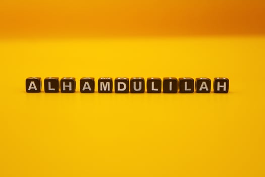 yellow background with the words alhamdulillah photo
