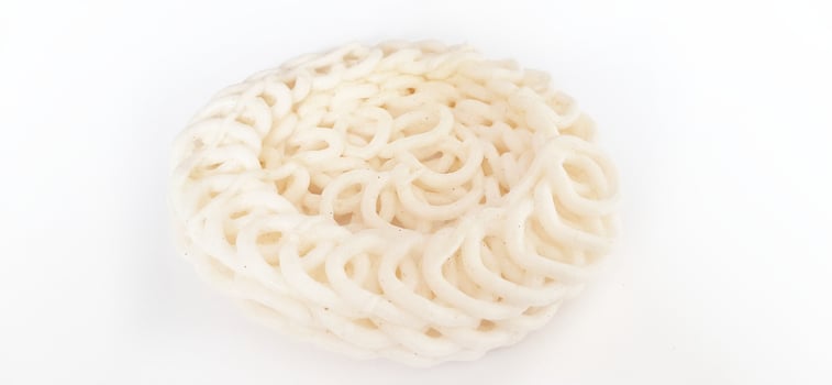 White noodle crackers or kerupuk putih or kerupuk warung made from tapioca flour, snack food from Indonesia isolated on white background photo