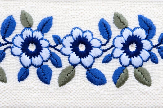 Elegant blue and white floral embroidery design inspired by Finnish folk tradition photo