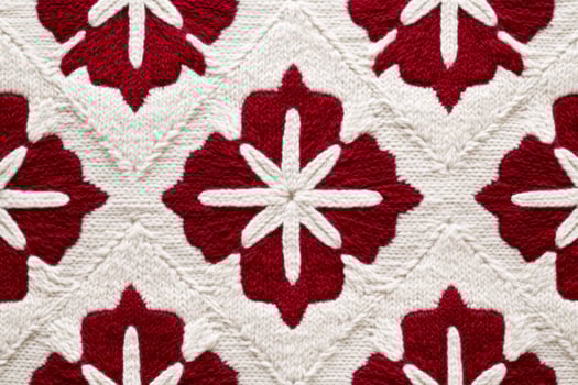 Cozy Scandinavian-inspired geometric pattern featuring festive red and white snowflakes for winter decor photo