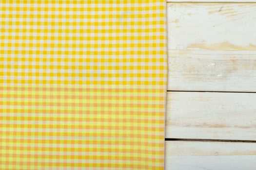Tablecloth textile on wooden background photo