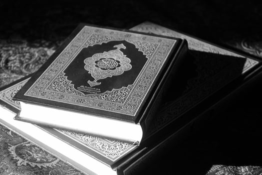 the quran is a holy book that is read by muslims around the world photo