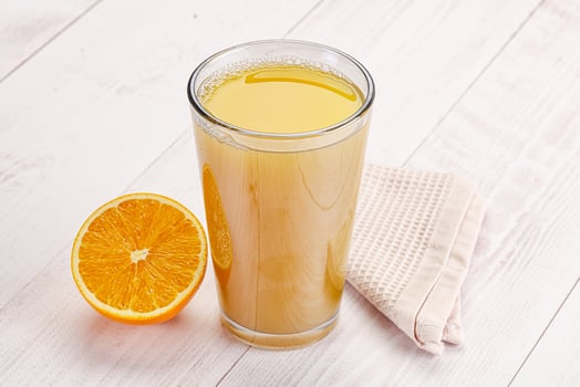 Sweet fresh orange juice in the glass photo
