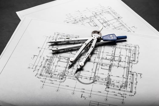 Construction planning drawings on black background photo