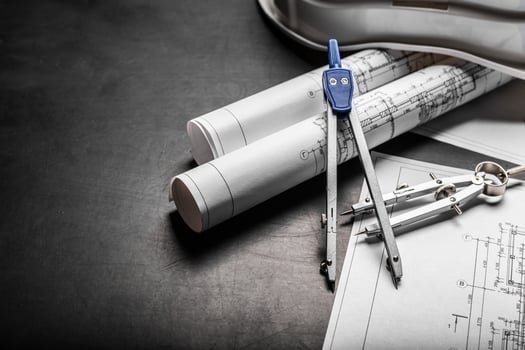 Construction planning drawings on black background photo
