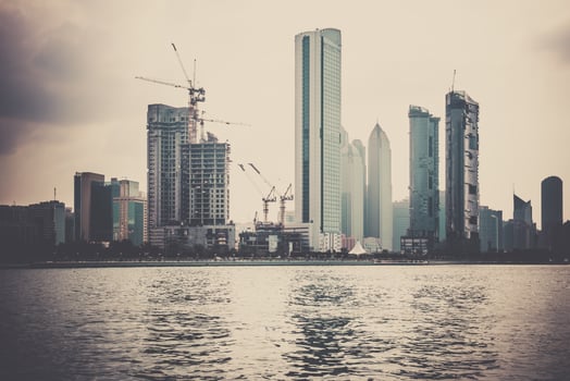 Abu Dhabi buildings skyline from the sea photo