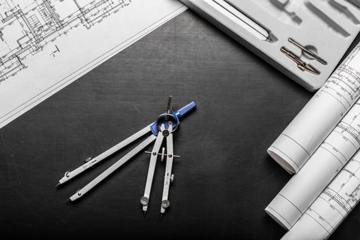 Construction planning drawings on black background photo