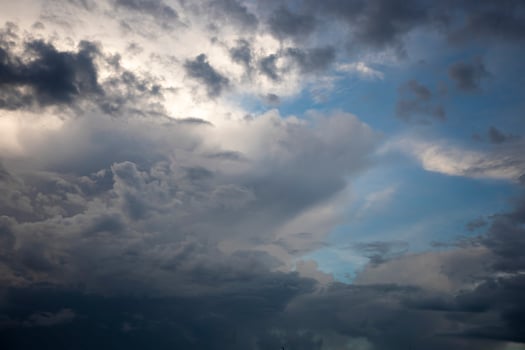 A cloud in the blue sky wide shot photo
