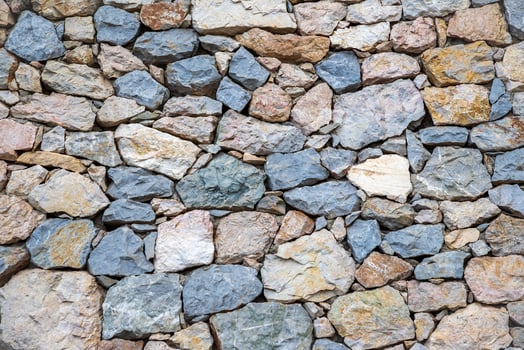 The surface of an old stone wall, perfect for the background. photo