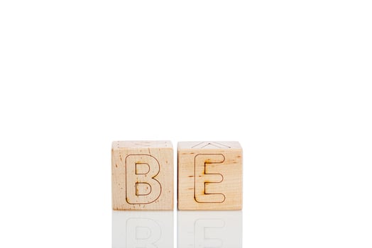 Wooden cubes with letters be on a white background photo
