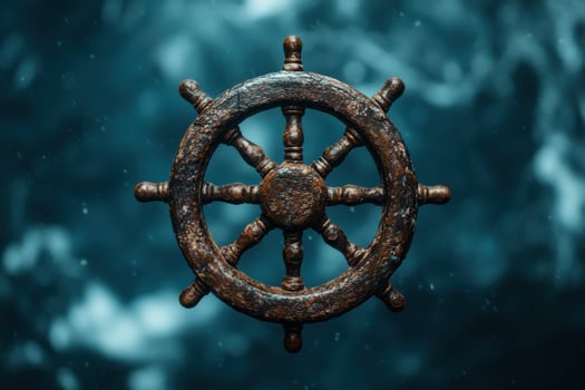 Antique ships wheel in a stormy sea photo