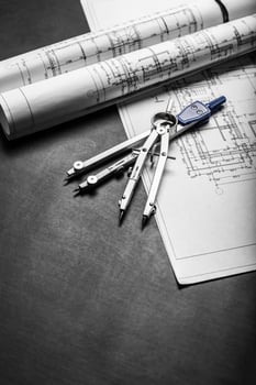 Construction planning drawings on black background photo