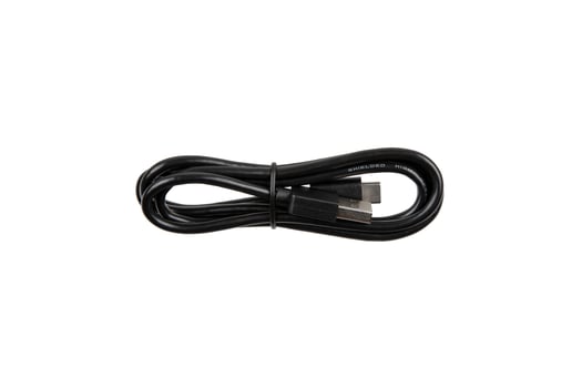 Black USB cable with two connectors, neatly coiled and secured with a strap, isolated on a white background. photo