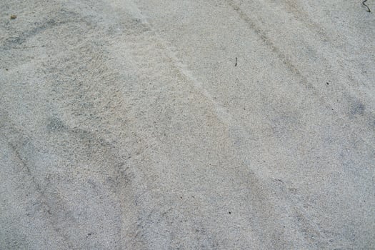 Close-up Texture of Sandy Surface photo
