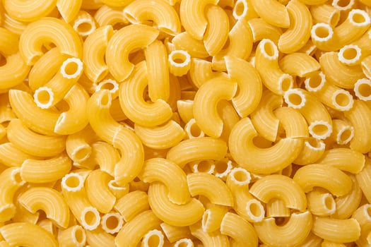 Uncooked Chifferi Rigati Pasta. A Culinary Canvas of Chifferi Rigati, Creating a Lively and Textured Background for Gourmet Cooking. Dry Pasta. Raw Macaroni - Top View, Flat Lay photo