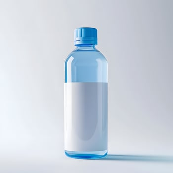 Plastic bottle with blue cap and white label for liquid drink photo