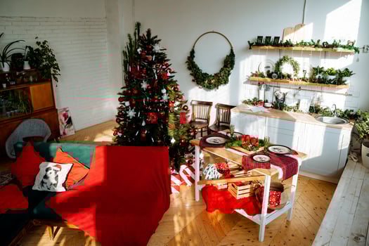 A living room with christmas decorations and a christmas tree photo