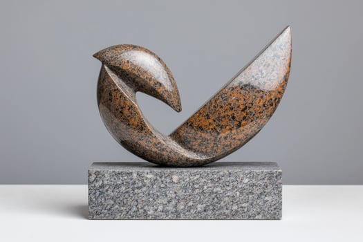 abstract granite sculpture on pedestal photo