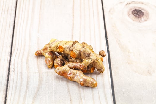 Fresh young Tumeric root heap photo