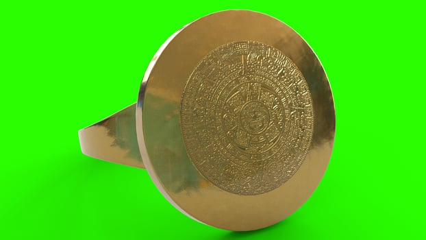 gold calendar ring with green background photo